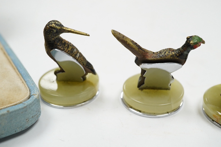 A cased Asprey set of four cold painted bronze and chrome plated novelty game bird menu holders, tallest 5cm high. Condition - good